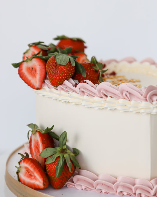 Strawberry buttercream Mother’s Day cake with fresh berries