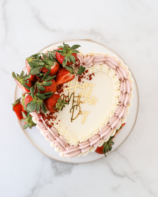Top view of strawberry buttercream Mother’s Day cake