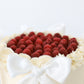Fresh raspberry topped buttercream cake with piped vanilla border