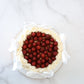 Top view of raspberry buttercream cake with white satin bows