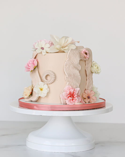Buttercream floral Mother’s Day cake with blush and ivory sugar flowers