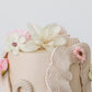 Decorative cake with floral elements on a white background