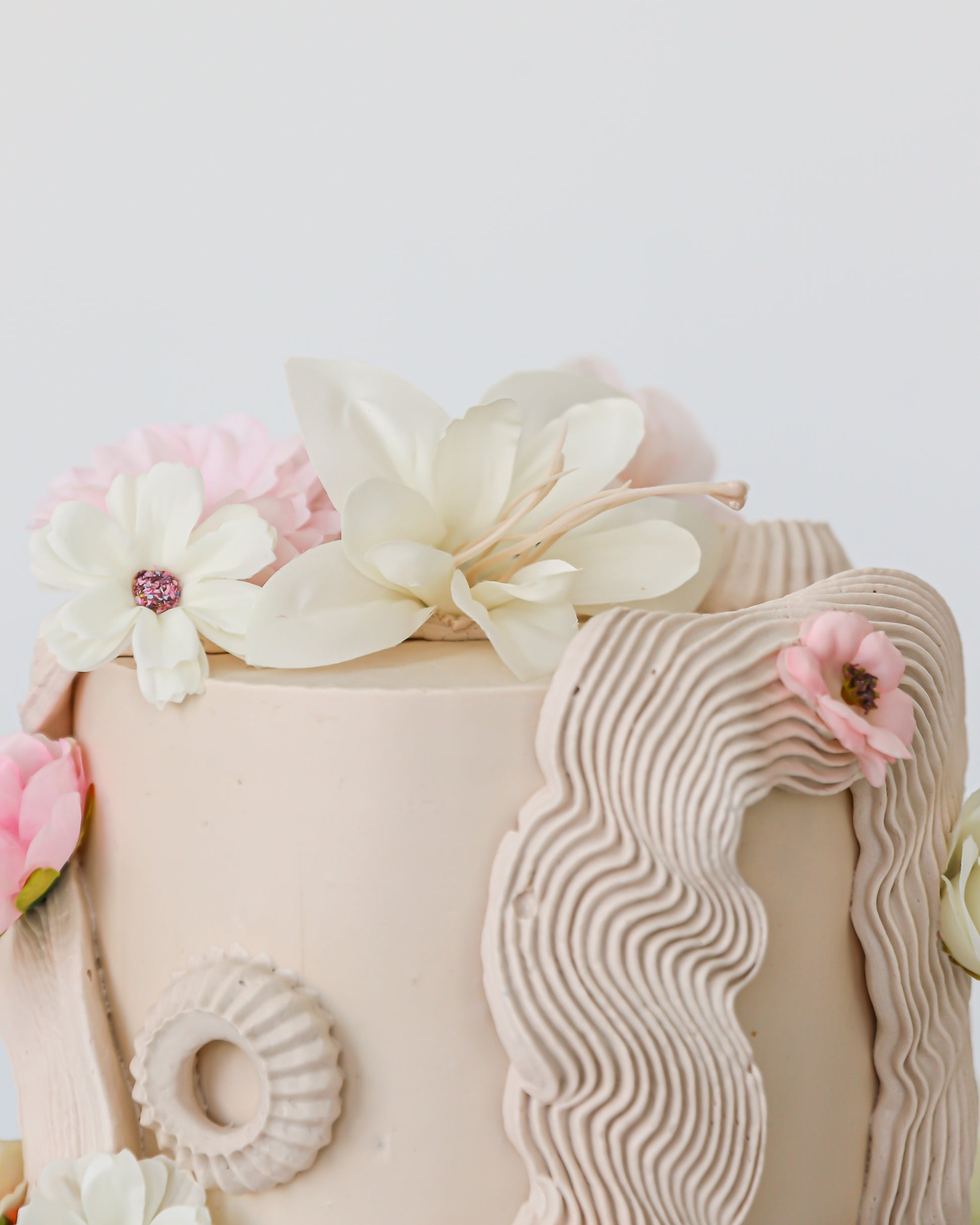 Decorative cake with floral elements on a white background