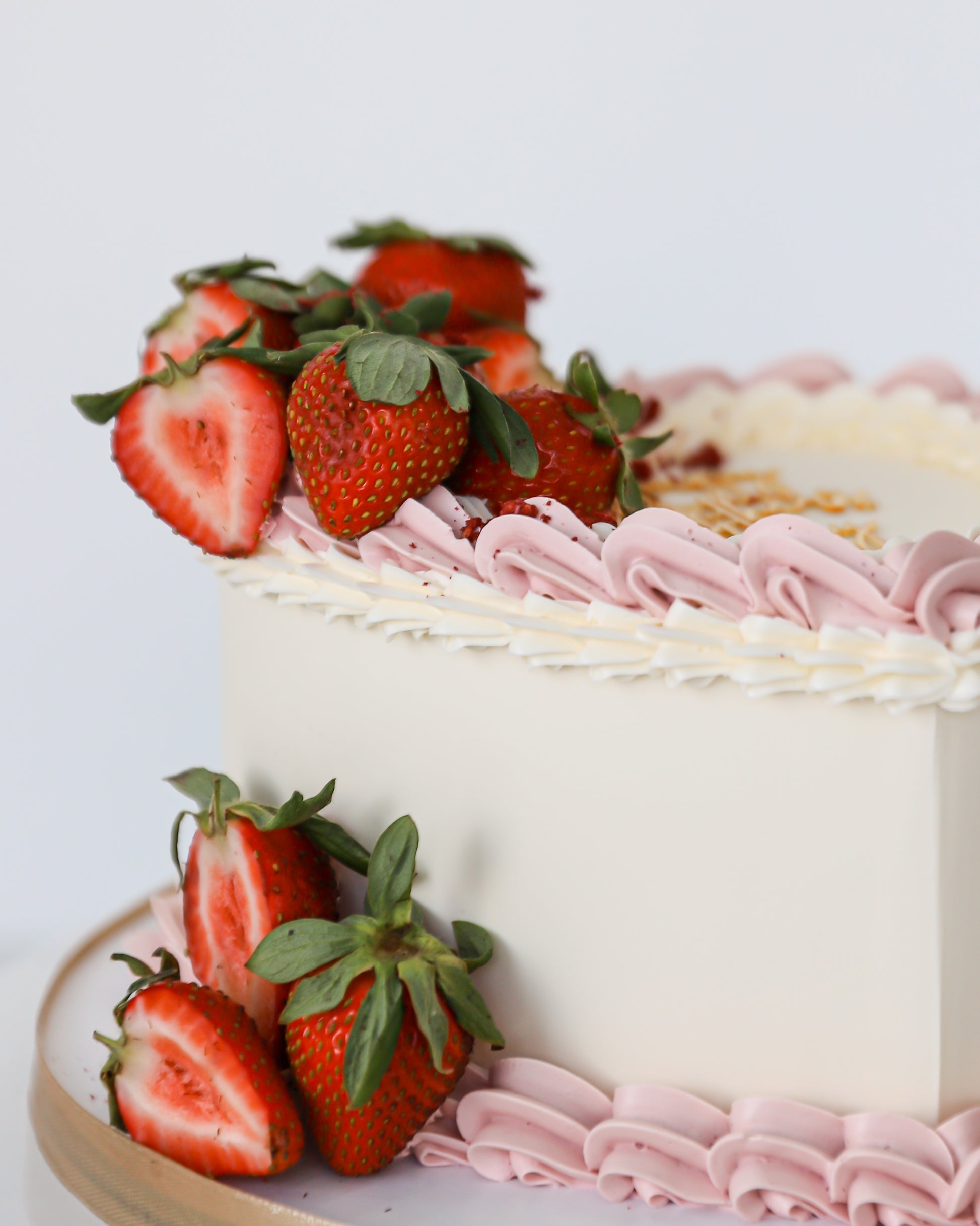 Strawberry buttercream Mother’s Day cake with fresh berries