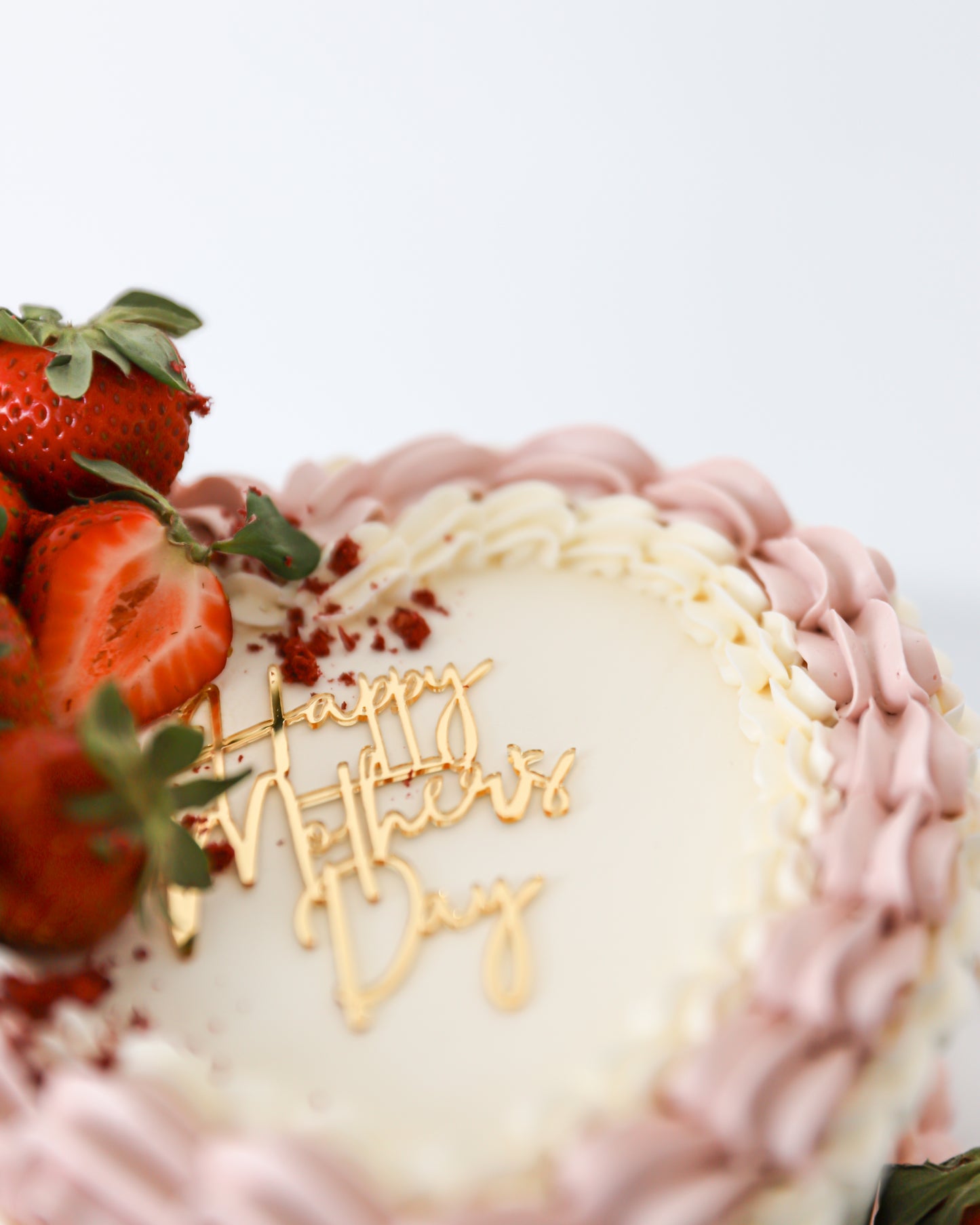 Close-up of strawberries and gold Happy Mother’s Day topper