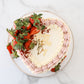 Top view of strawberry buttercream Mother’s Day cake