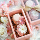 Mother’s Day cakelet gift box with edible flowers and macaron topper