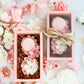 Elegant floral cakelet box styled with pink and ivory spring flowers