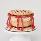Sweetie Pie cherry vintage lattice cake with golden buttercream, red cherry filling, cream ruffle band, and red gingham ribbon cascades